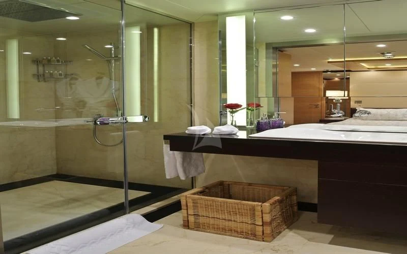 a bathroom with a large mirror aboard TATIANA I Yacht for Sale