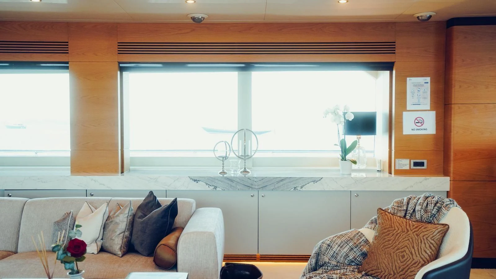 a living room with a large window aboard TATIANA I Yacht for Sale