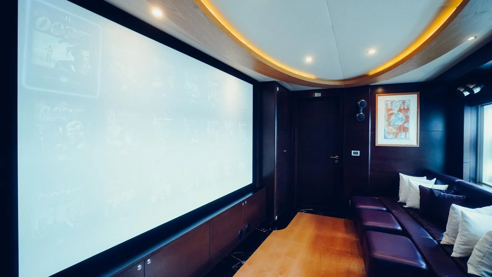a room with a large screen aboard TATIANA I Yacht for Sale