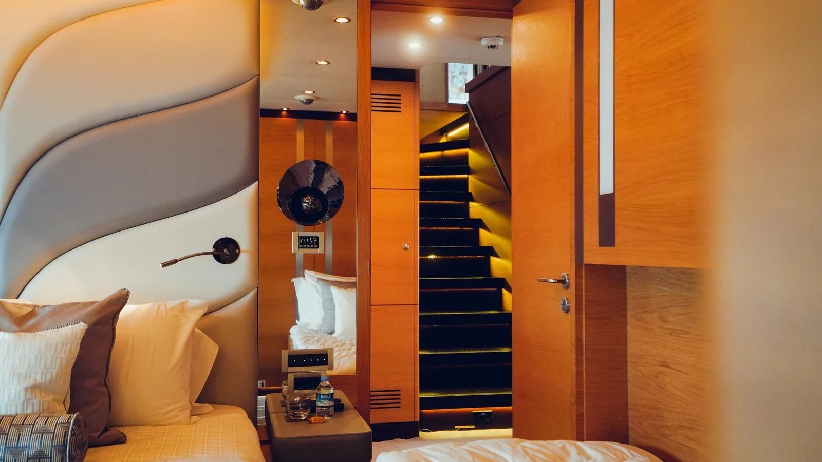 a room with a bed and a staircase aboard TATIANA I Yacht for Sale