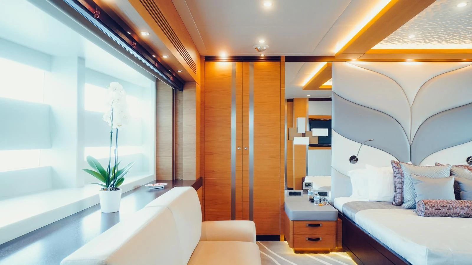 a room with a bed and a desk aboard TATIANA I Yacht for Sale