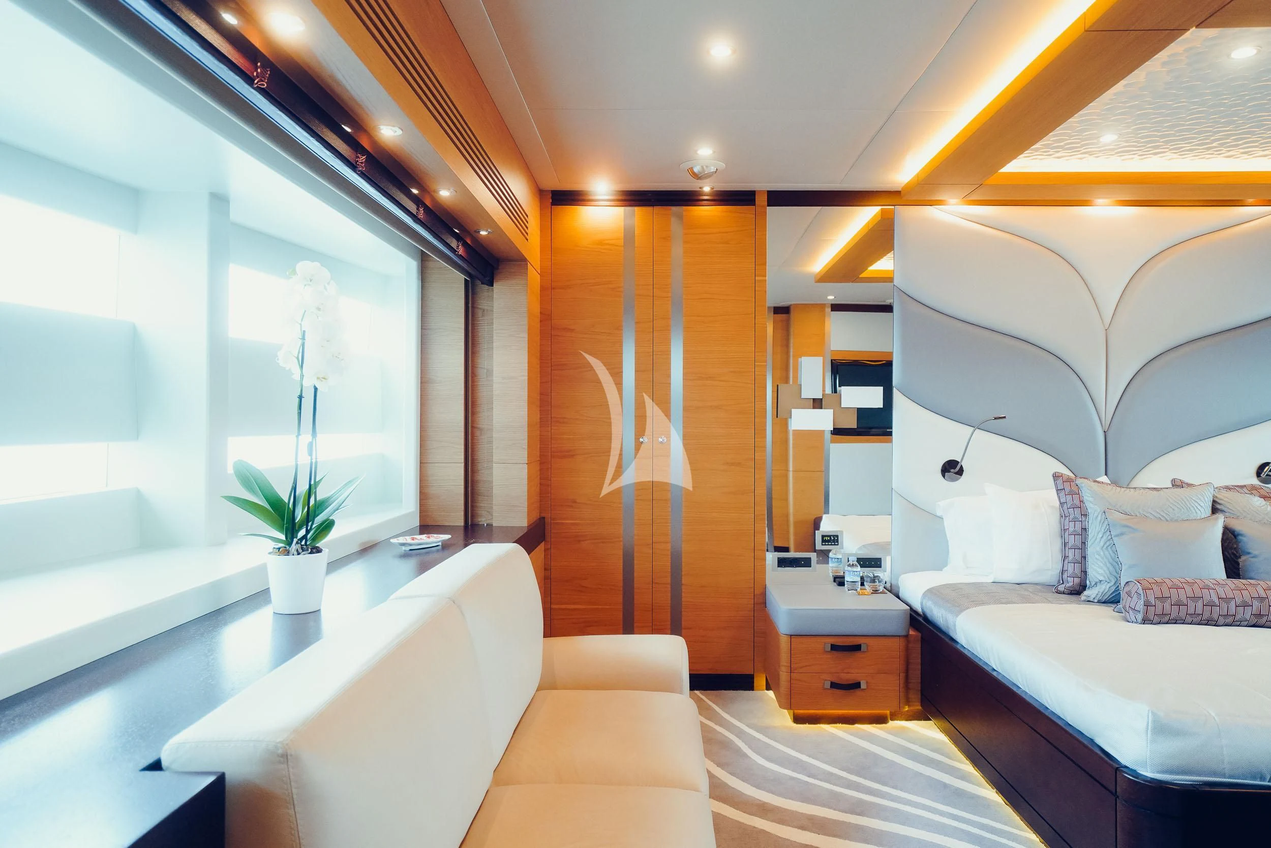 a room with a bed and a desk aboard TATIANA I Yacht for Sale