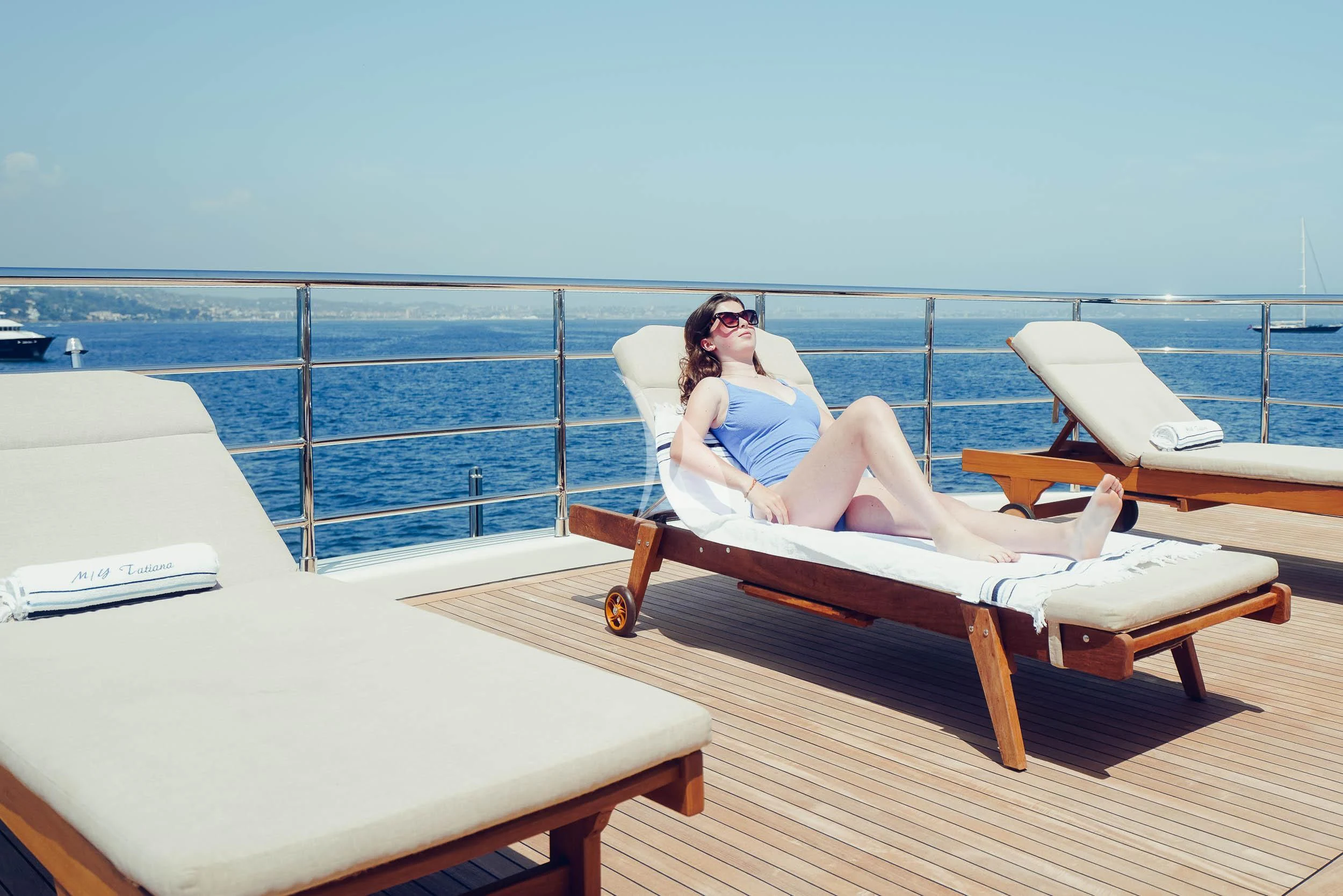 a person sitting on a bench aboard TATIANA I Yacht for Sale