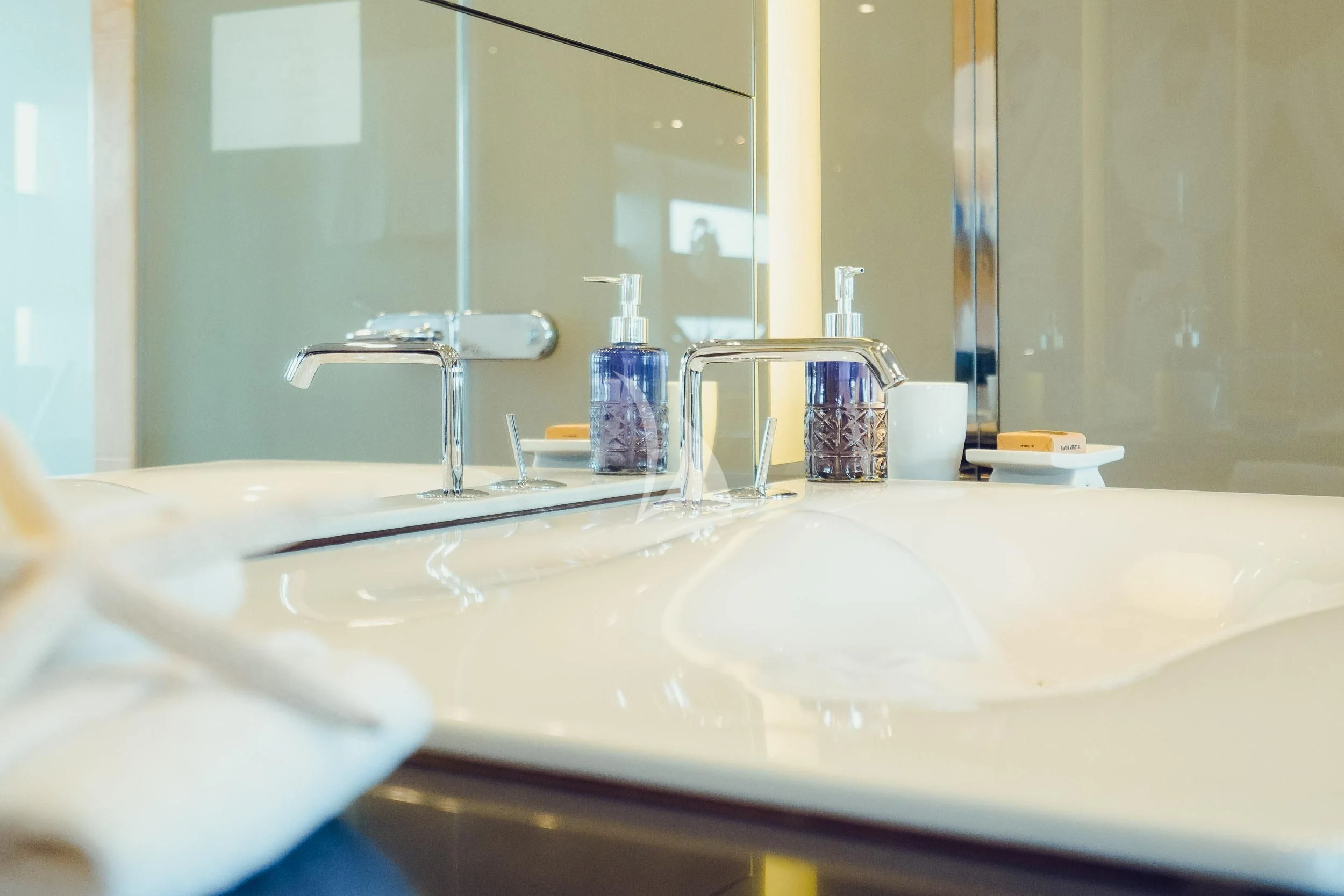 a bathroom sink with a large mirror aboard TATIANA I Yacht for Sale