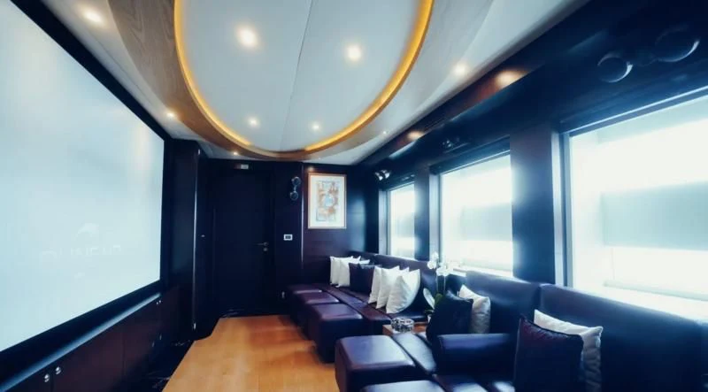 a room with a couch and a window aboard TATIANA I Yacht for Sale