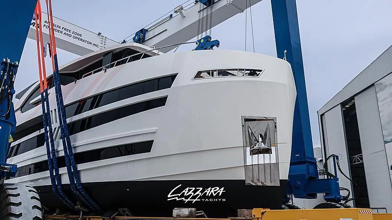 a boat with a flag on the front aboard SANDRO Yacht for Sale