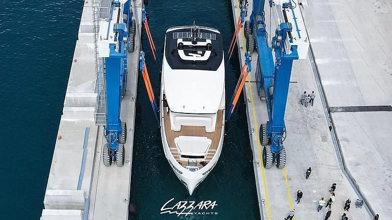 a large boat on a body of water aboard SANDRO Yacht for Sale