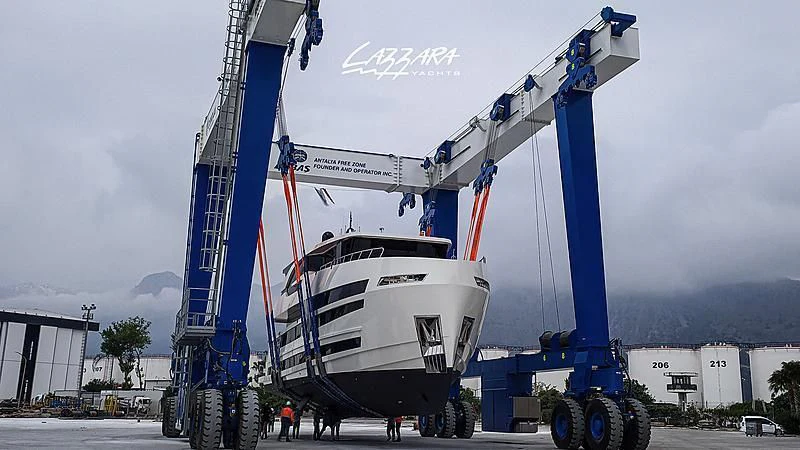 a large white boat on a trailer aboard SANDRO Yacht for Sale