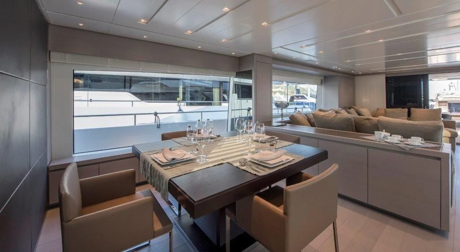 a large kitchen with a table aboard SEN Yacht for Sale