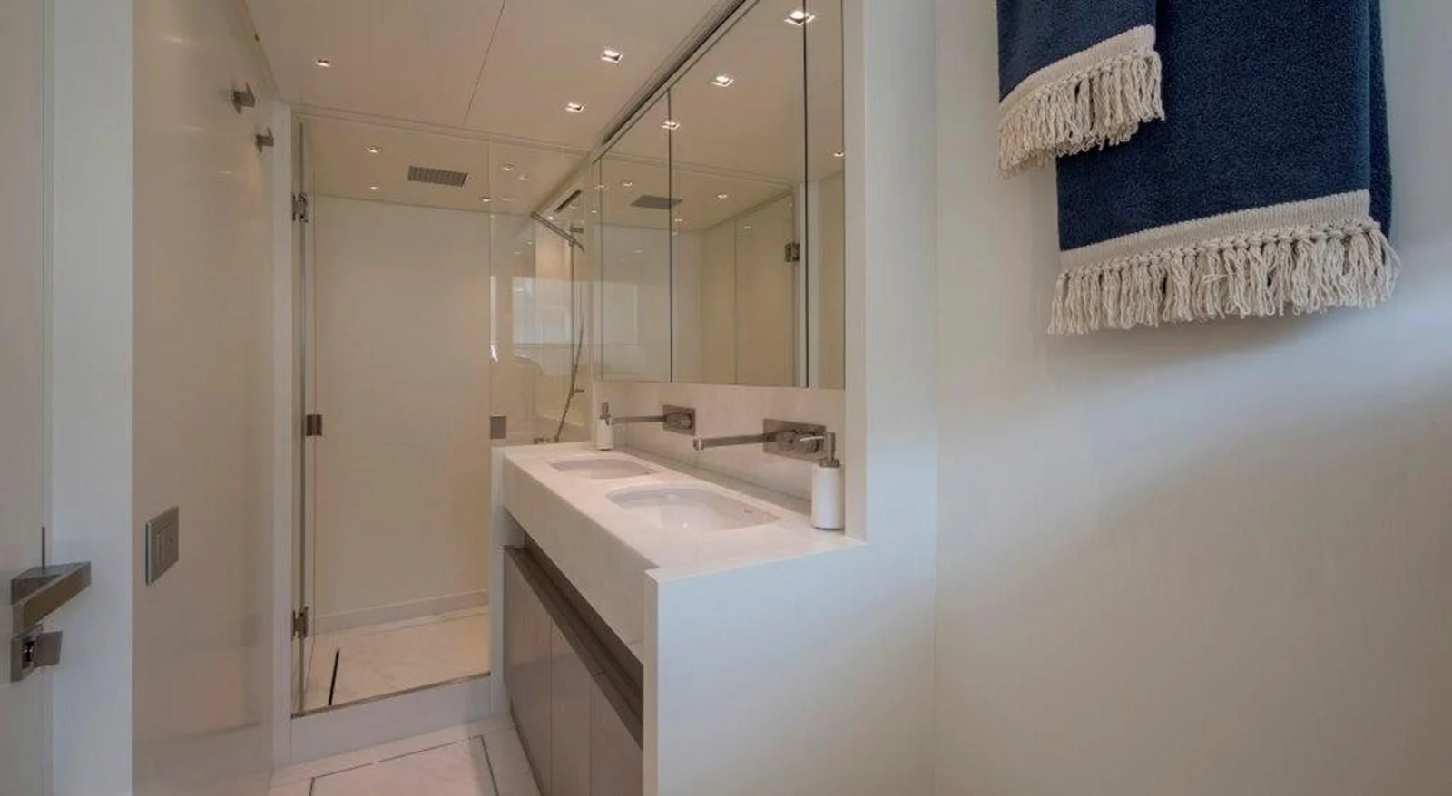 a bathroom with a sink and a mirror aboard SEN Yacht for Sale