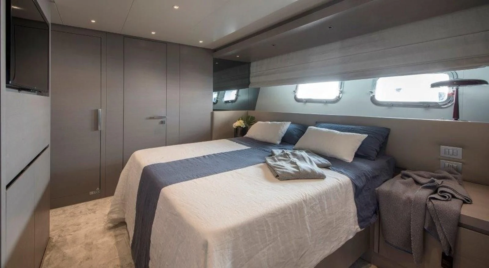 a bed in a room aboard SEN Yacht for Sale