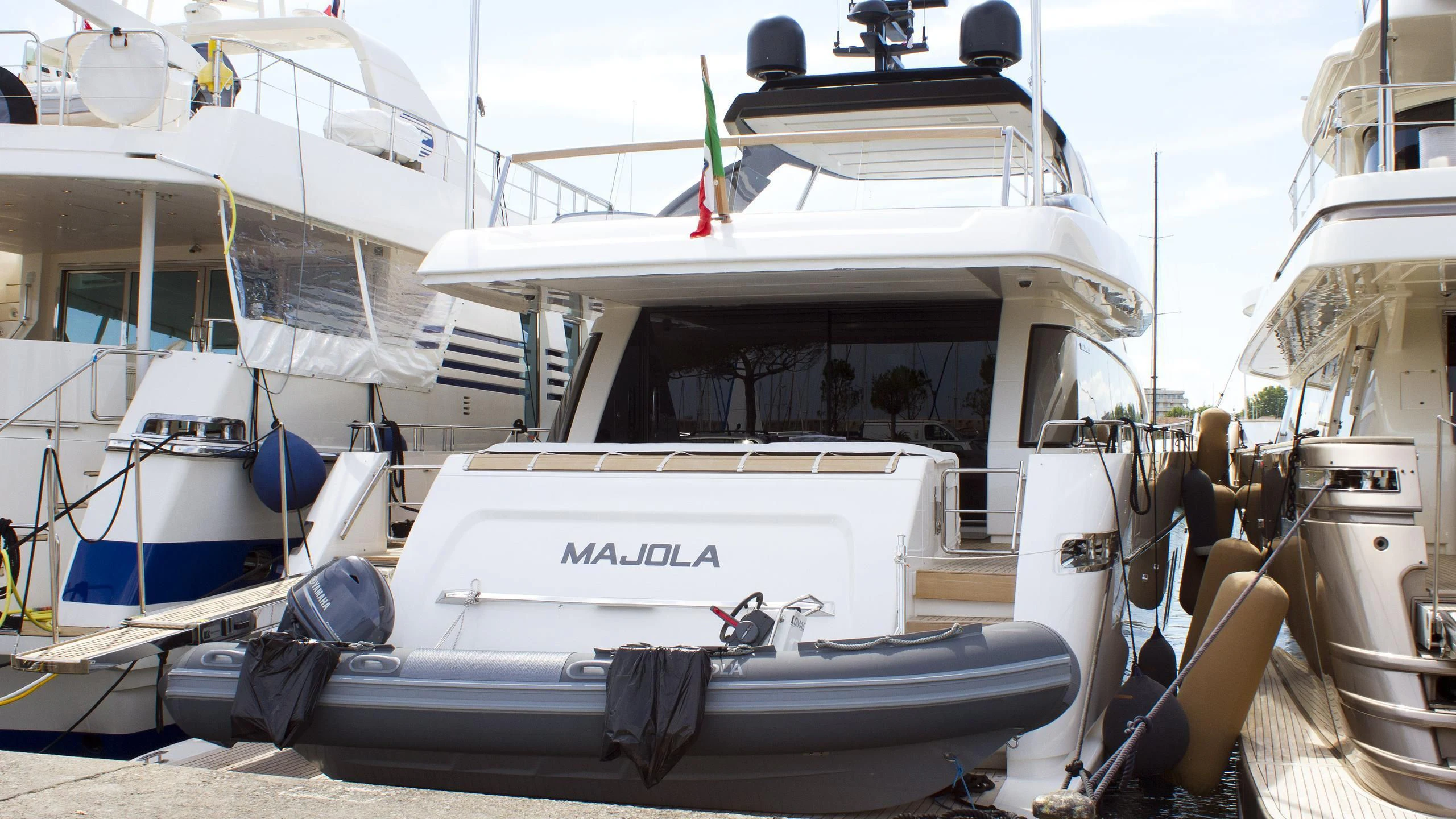 several boats docked at a pier aboard SEN Yacht for Sale