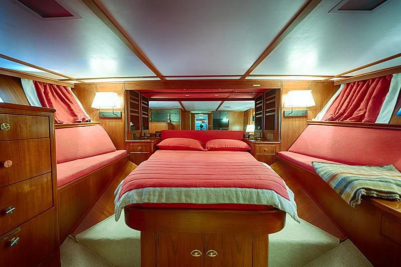a room with a bed and a couch aboard JURA II Yacht for Sale