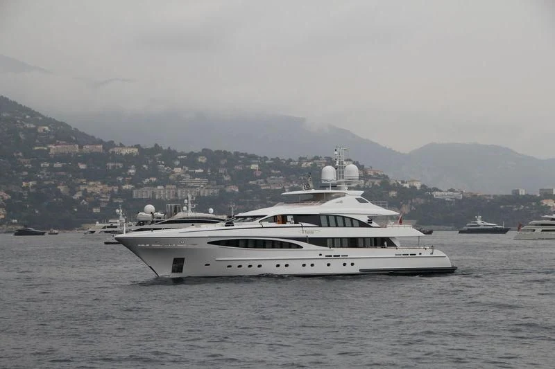 a large white boat in the water aboard YALLA Yacht for Sale