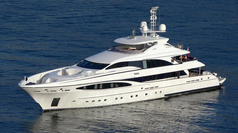 a white yacht in the water aboard YALLA Yacht for Sale