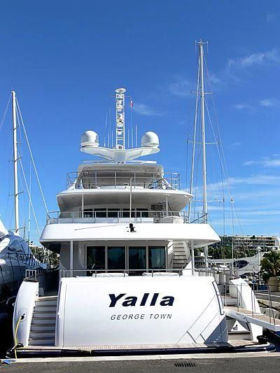 a boat with a large ship in the water aboard YALLA Yacht for Sale