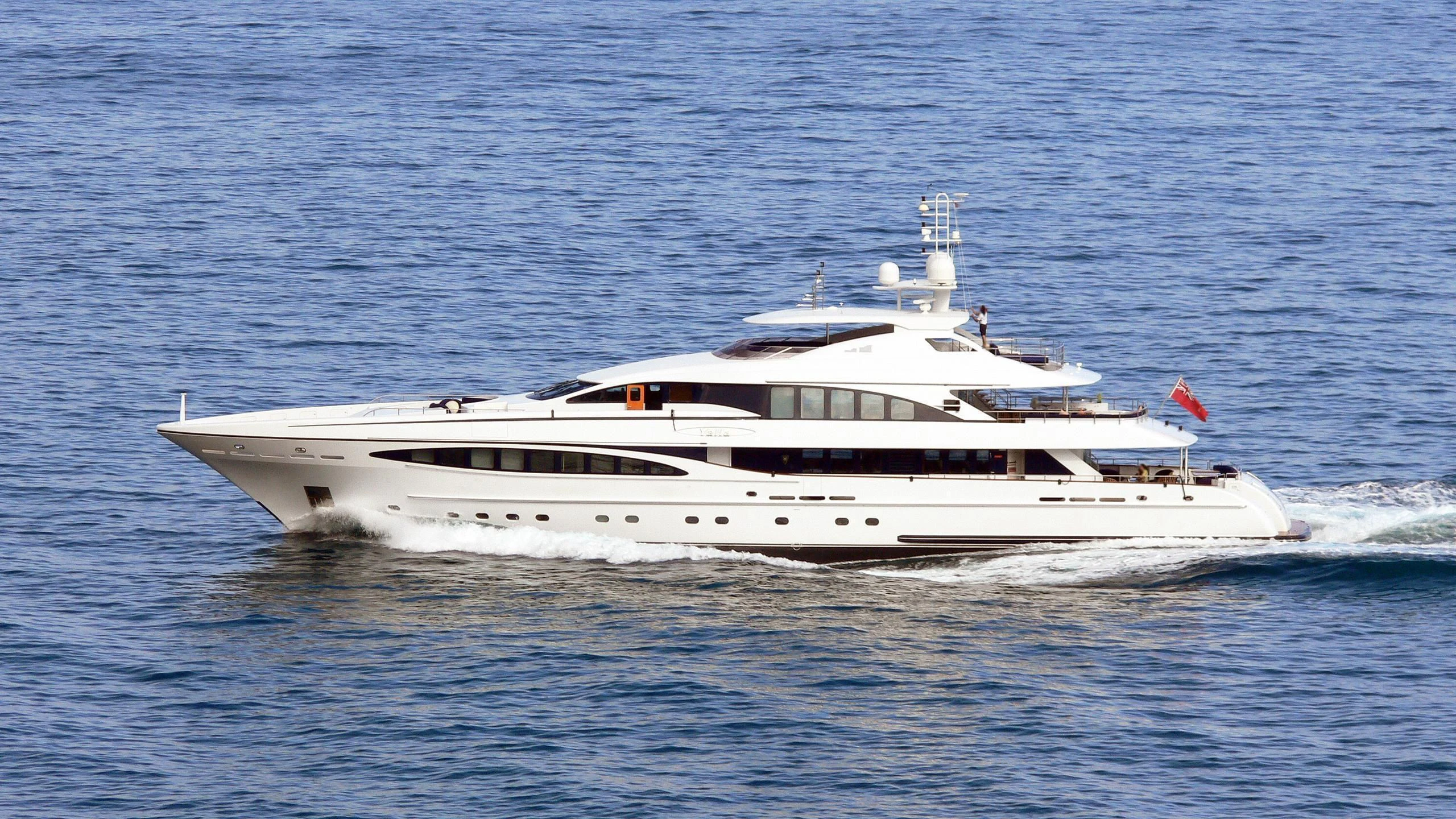 a white yacht on the water aboard YALLA Yacht for Sale