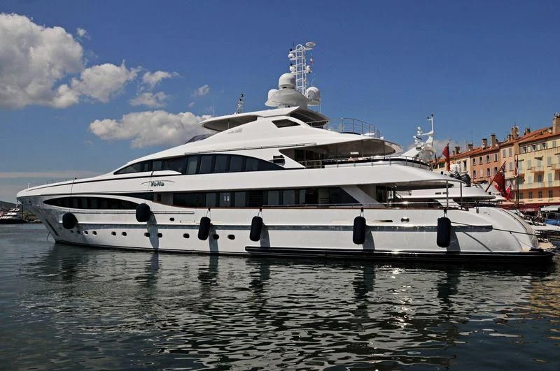 a large white yacht in the water aboard YALLA Yacht for Sale