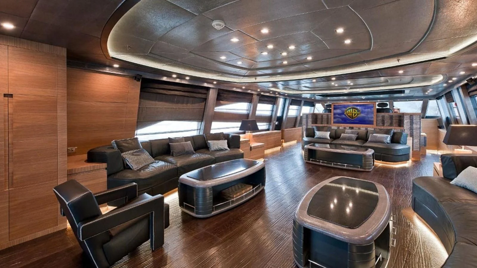 a large living room with leather couches and a table aboard ELIZAVETA Yacht for Sale