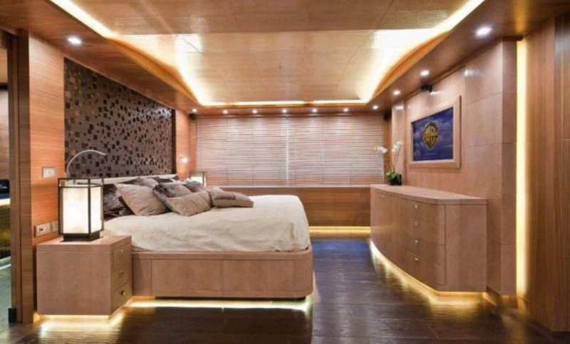 a room with a bed and a desk aboard ELIZAVETA Yacht for Sale