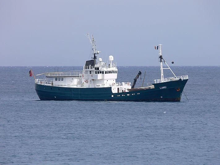 a large boat in the water aboard KREBS RESEARCH Yacht for Sale