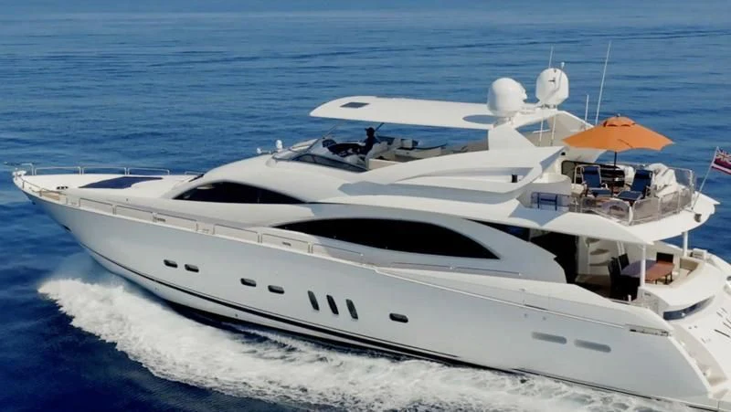 a white yacht on the water aboard NAKOA Yacht for Sale
