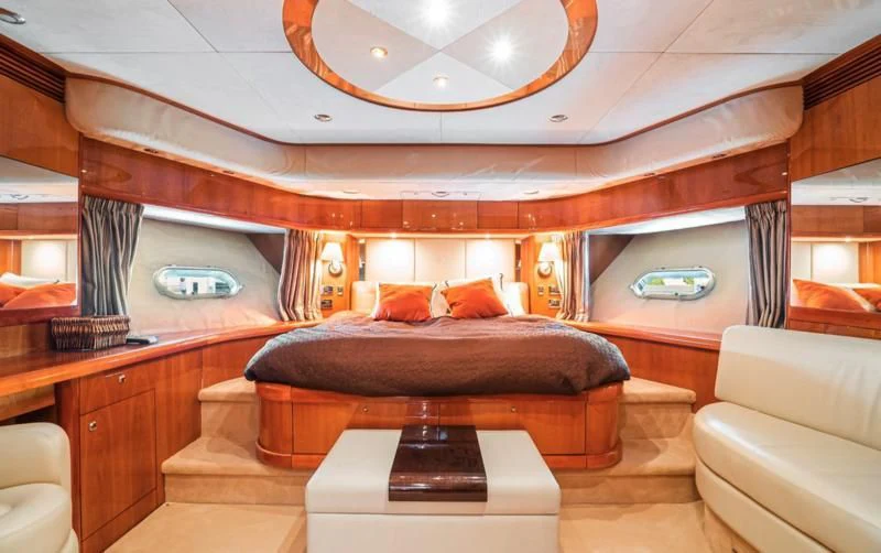 a large room with a couch and a table aboard NAKOA Yacht for Sale