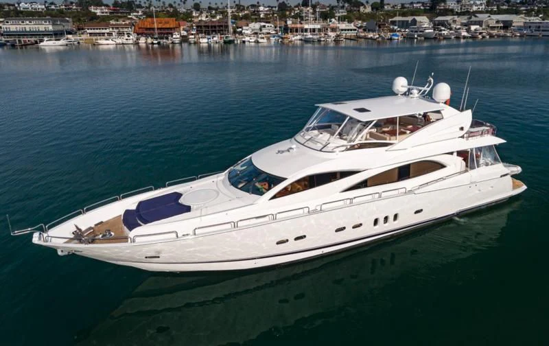 a white yacht on the water aboard NAKOA Yacht for Sale