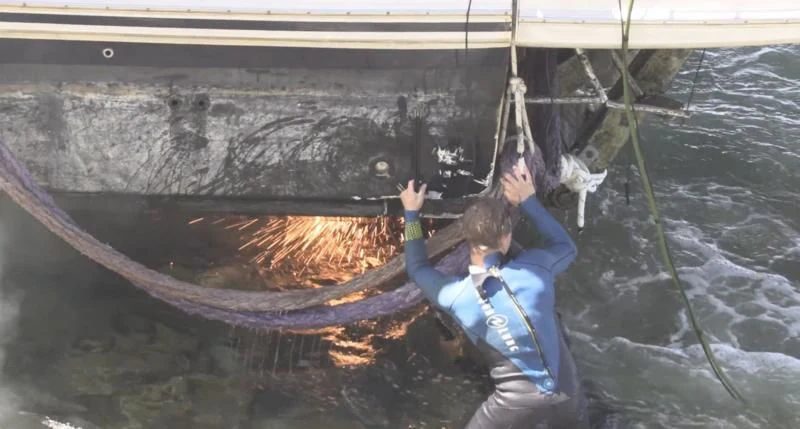 a man climbing a rock wall aboard NAKOA Yacht for Sale