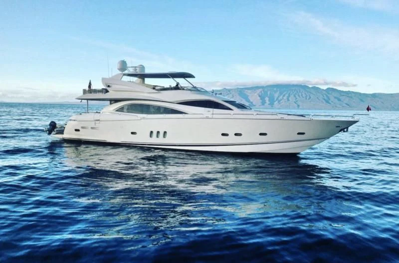 a white yacht in the water aboard NAKOA Yacht for Sale