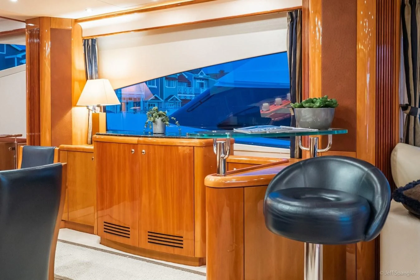 a room with a tv and a table aboard NAKOA Yacht for Sale