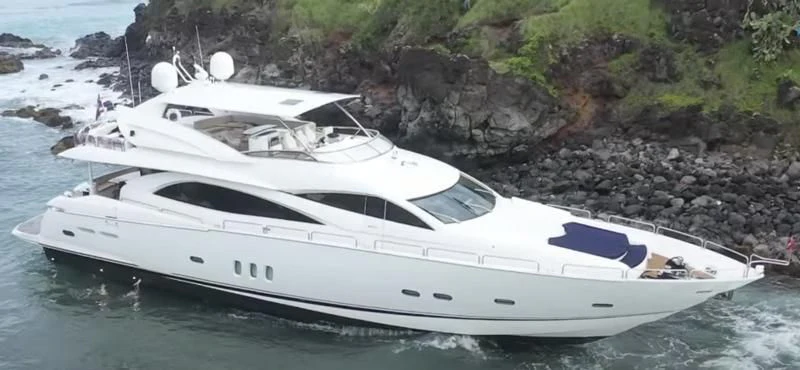 a white yacht on the water aboard NAKOA Yacht for Sale