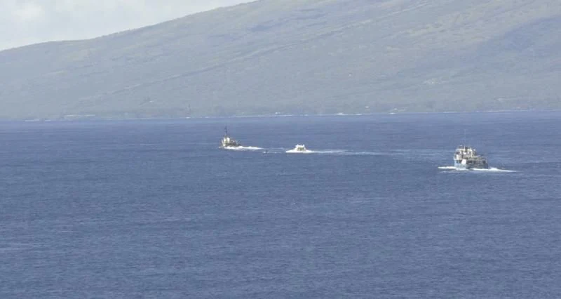 a group of ships in the ocean aboard NAKOA Yacht for Sale