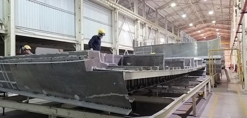 a few workers in a factory aboard INFINITE JEST Yacht for Sale