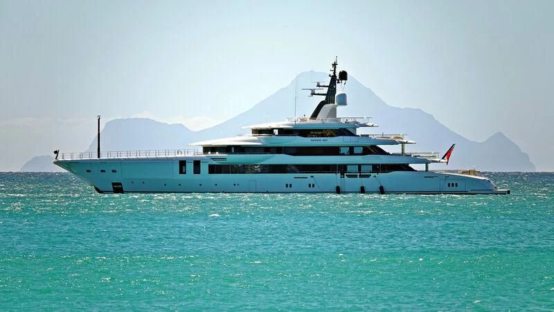 a large white boat in the water aboard INFINITE JEST Yacht for Sale