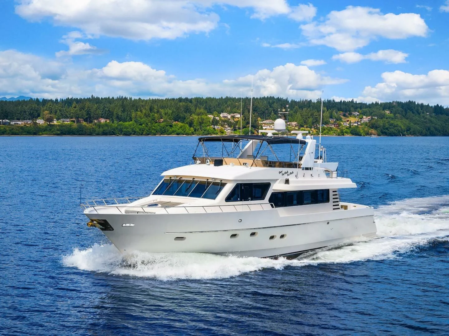a white boat on water aboard QUE SA-RAH SA-RAH Yacht for Sale