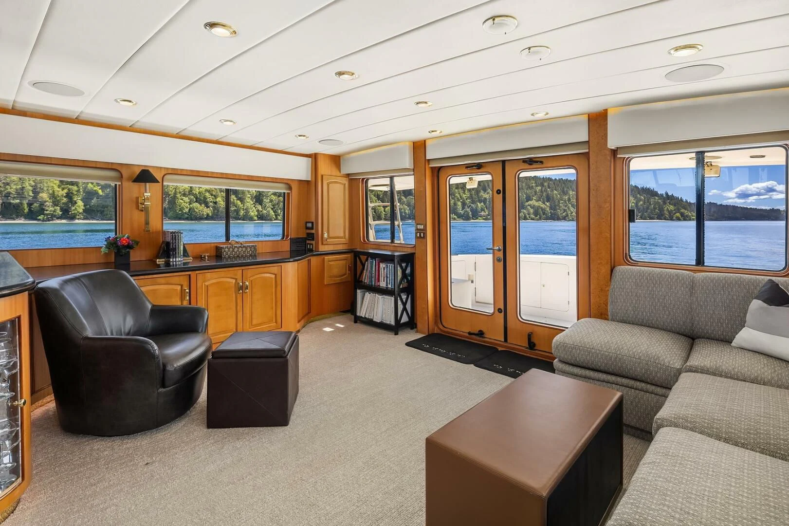 a living room with a couch and a coffee table aboard QUE SA-RAH SA-RAH Yacht for Sale