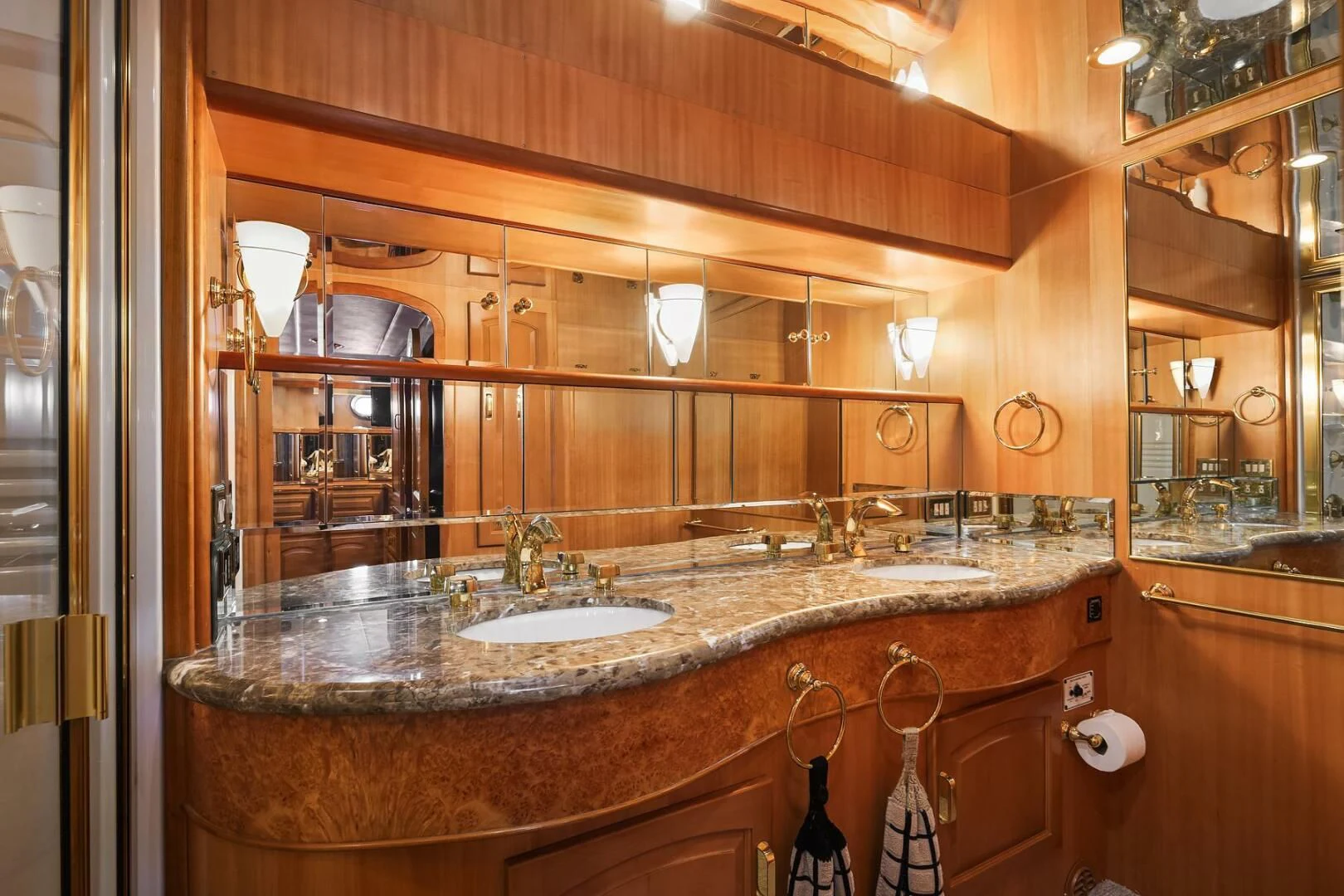 a bathroom with a sink and a mirror aboard QUE SA-RAH SA-RAH Yacht for Sale