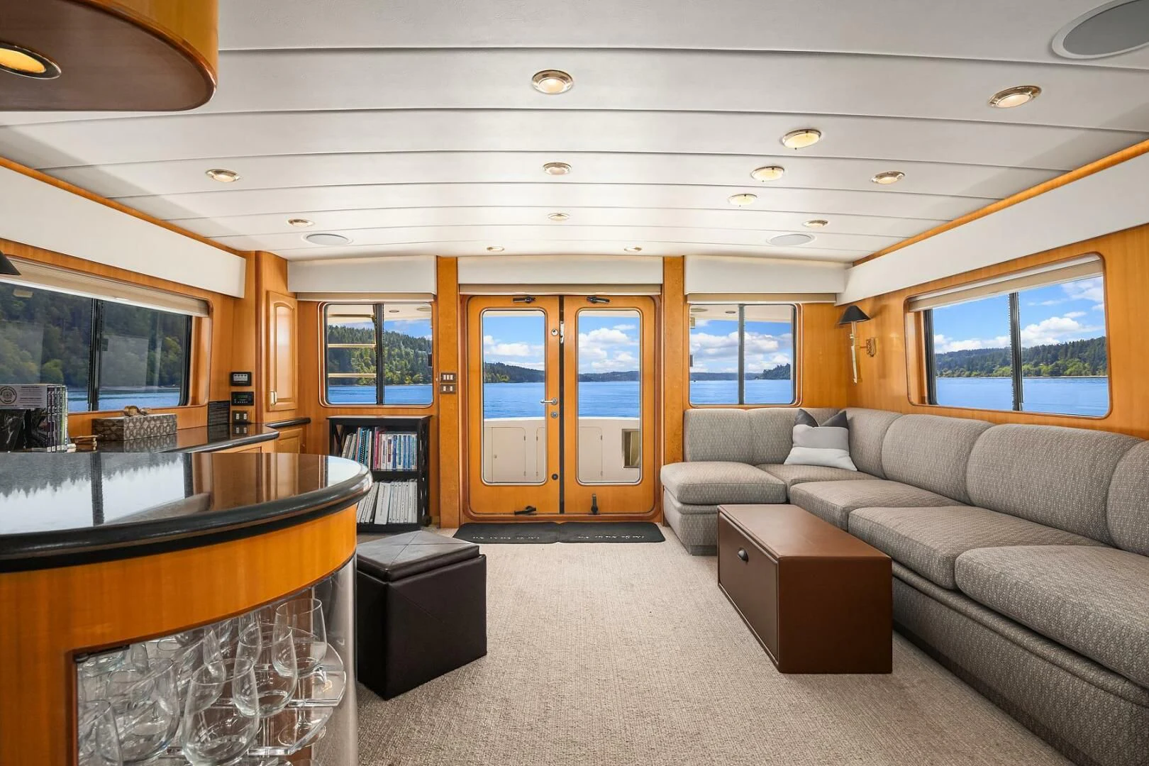 a living room with a fireplace aboard QUE SA-RAH SA-RAH Yacht for Sale