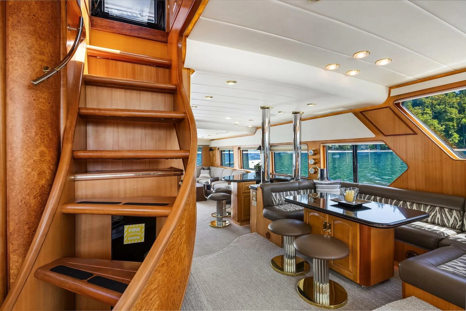 a room with a table and chairs aboard QUE SA-RAH SA-RAH Yacht for Sale