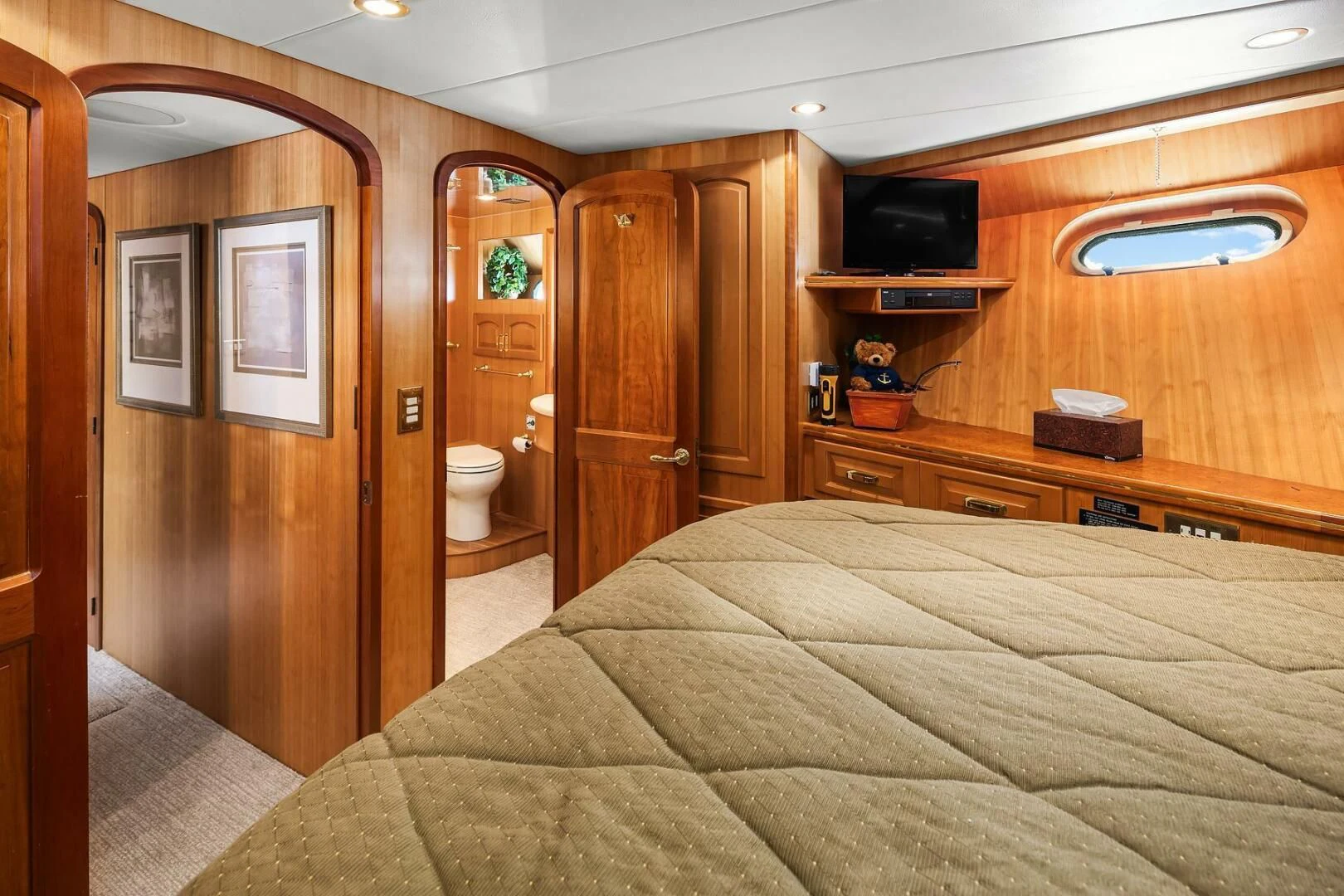 a bedroom with a bed and a closet aboard QUE SA-RAH SA-RAH Yacht for Sale