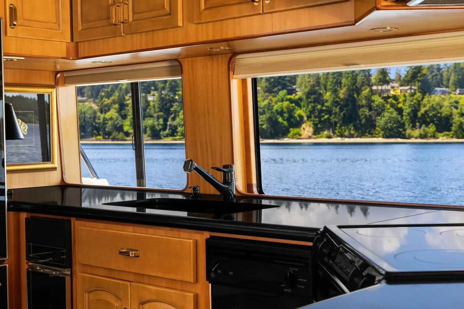 a kitchen with a large window aboard QUE SA-RAH SA-RAH Yacht for Sale
