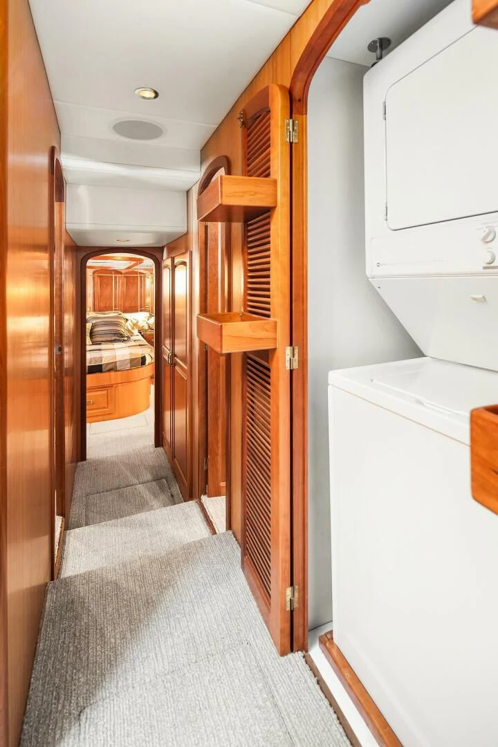 a hallway with a wood door aboard QUE SA-RAH SA-RAH Yacht for Sale