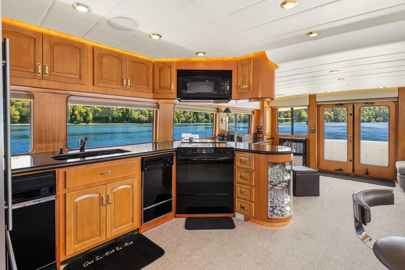 a kitchen with black appliances aboard QUE SA-RAH SA-RAH Yacht for Sale