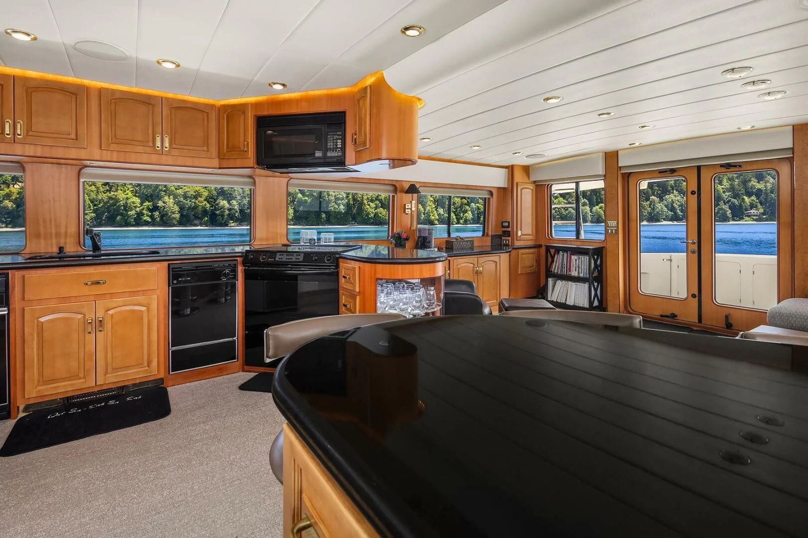 a large kitchen with wooden cabinets aboard QUE SA-RAH SA-RAH Yacht for Sale