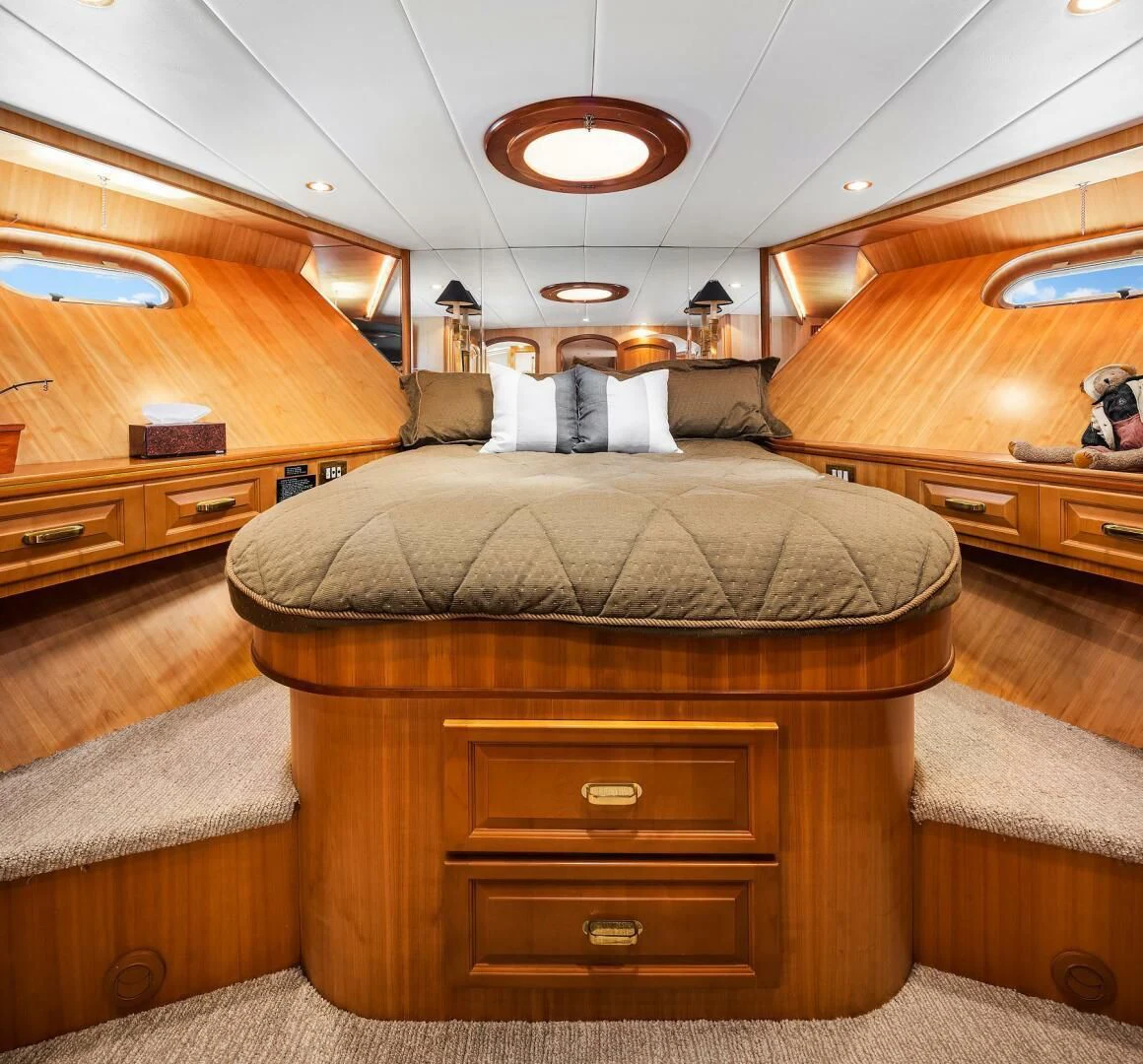 a room with a couch and a dresser aboard QUE SA-RAH SA-RAH Yacht for Sale