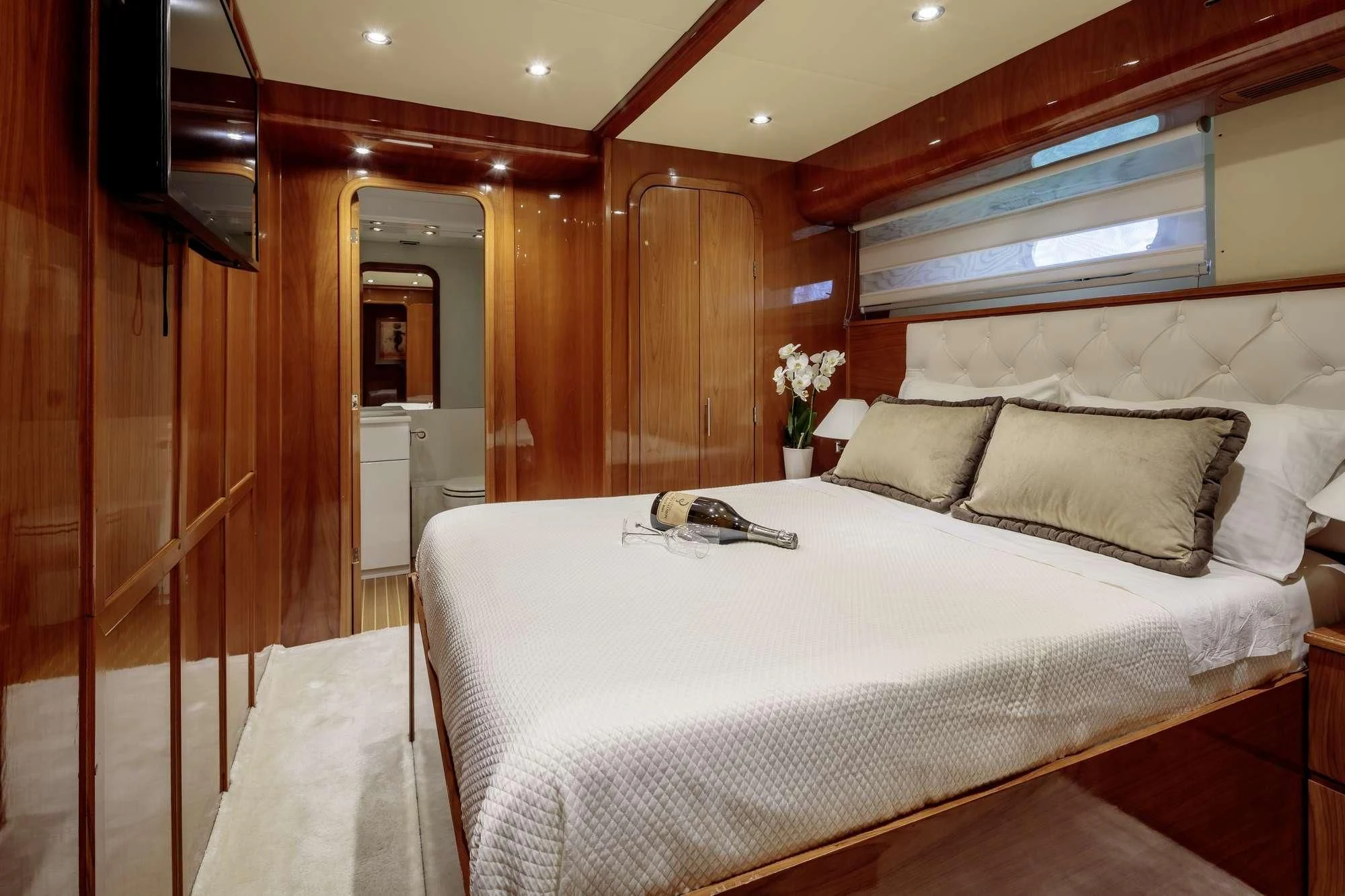 a bed in a room aboard EFMARIA Yacht for Sale