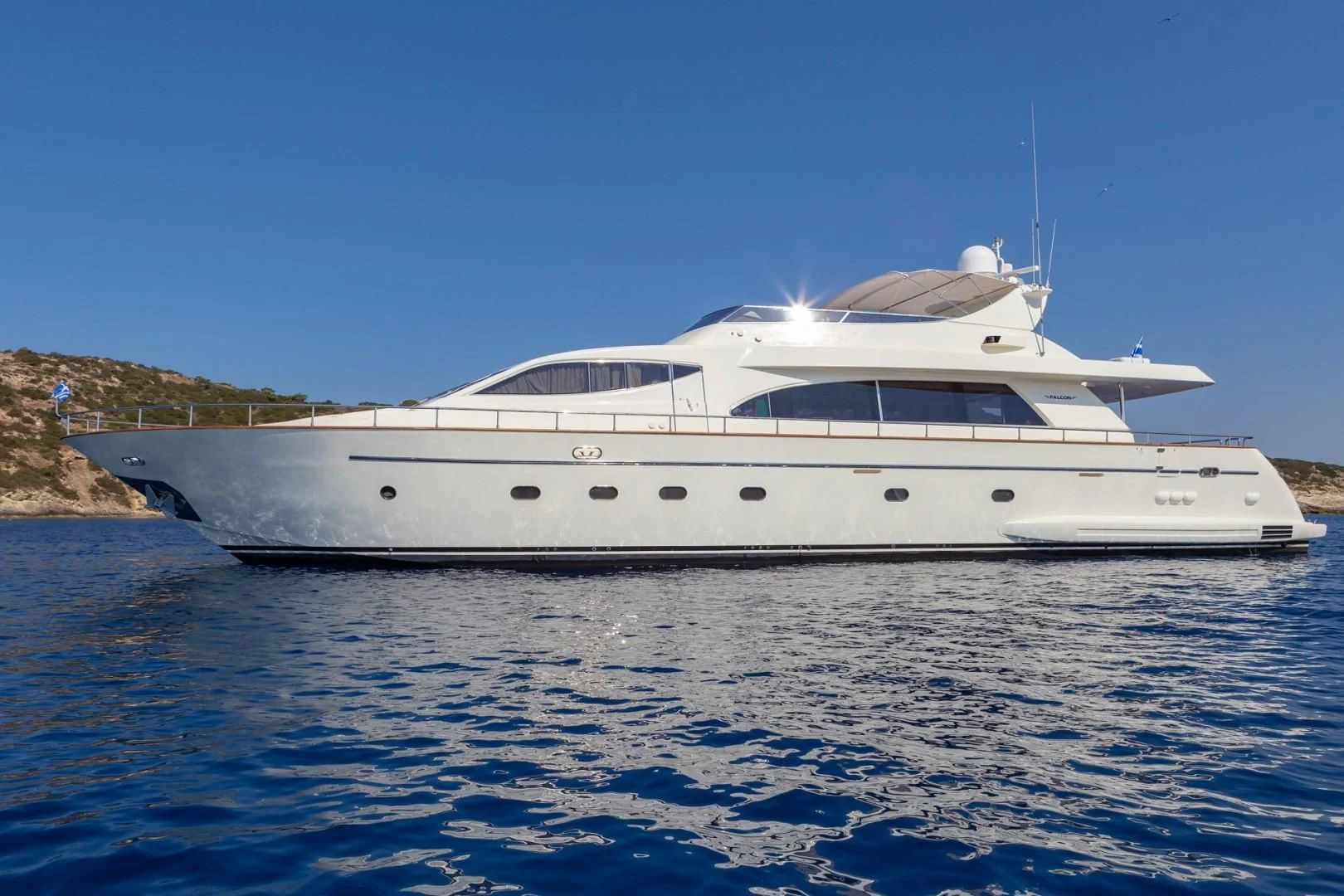a white yacht on the water aboard EFMARIA Yacht for Sale