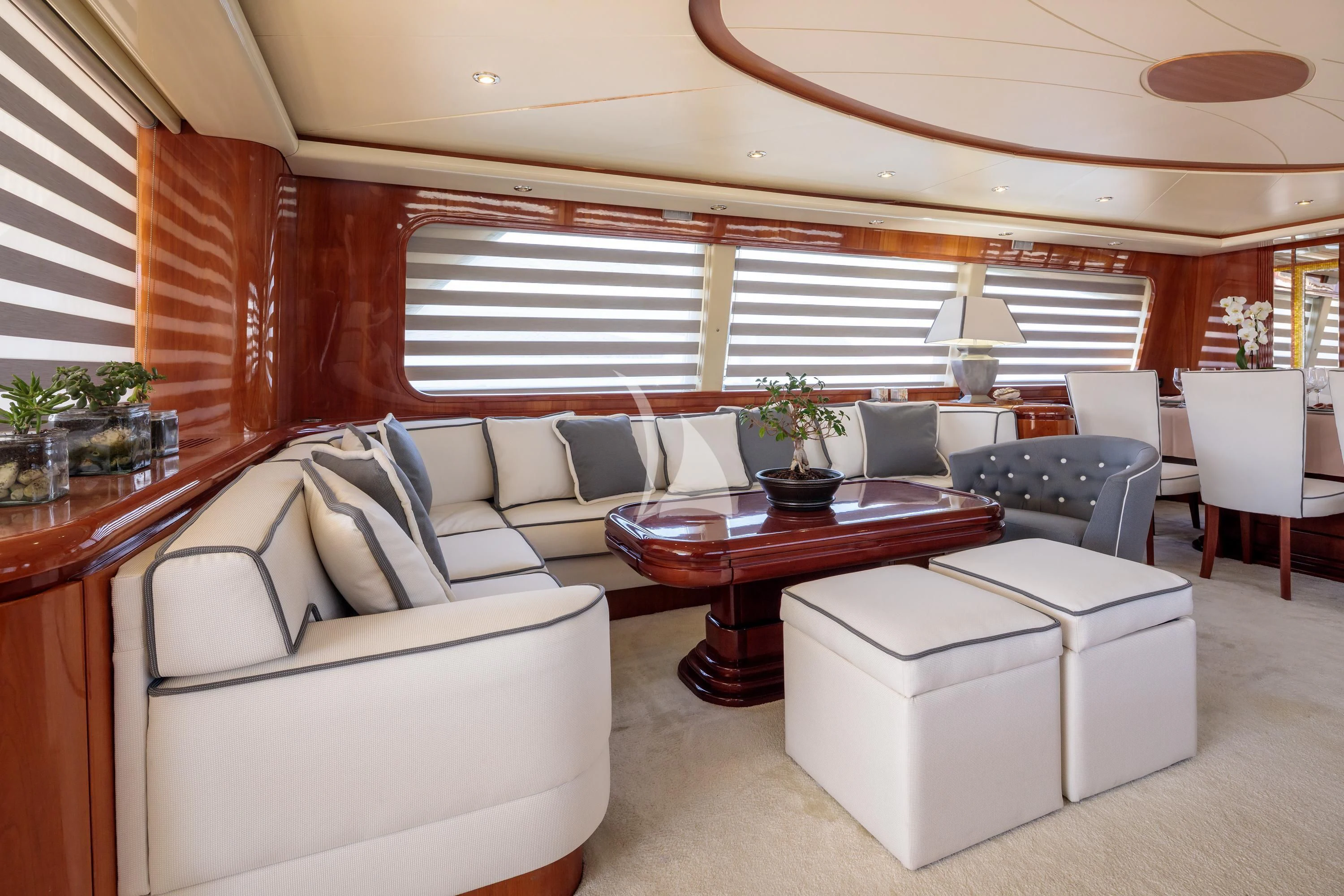 a living room with a couch and a table aboard EFMARIA Yacht for Sale