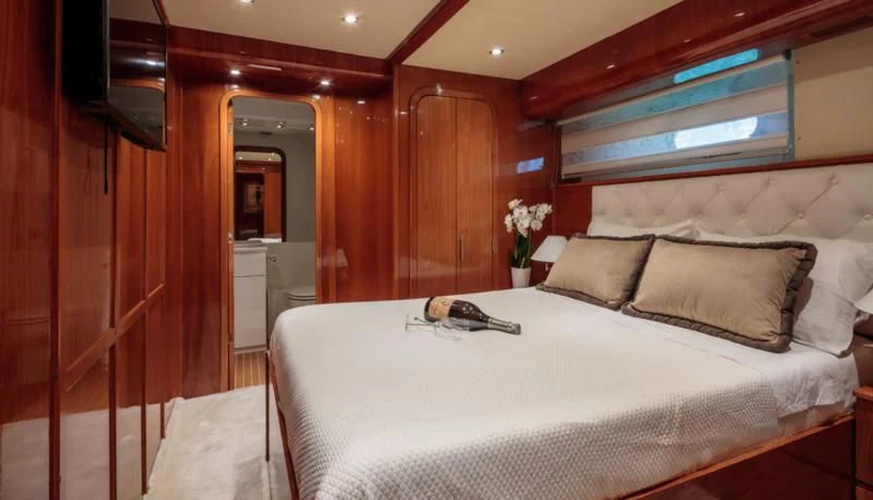 a bed in a room aboard EFMARIA Yacht for Sale